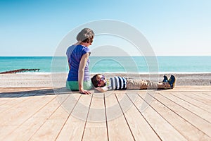 Woman playing with her son on the beach