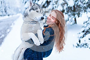 Woman playing with husky dog, friendship forever