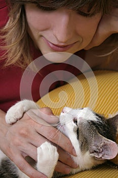 Woman playing with kitten