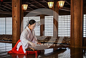 Woman playing the Koto in the Kasuga-taisha shrine, Nara prefecture, Kansai, Japan