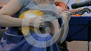 Woman playing mandolin