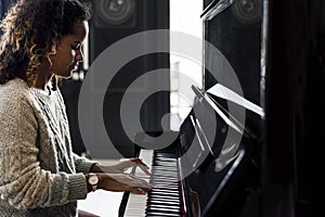 Woman playing on a piano