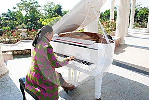 The woman playing piano