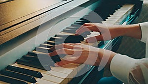 woman playing piano hands on piano