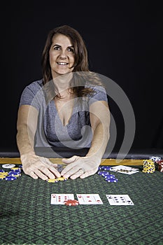 A woman playing poker at a table