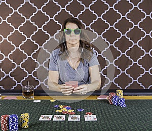 A woman playing poker at a table