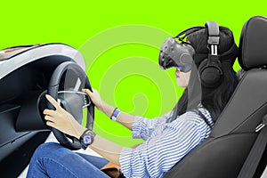 Woman playing a racing game in a simulator car