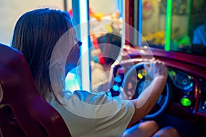 Woman playing racing simulator game