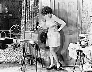 Woman playing record player photo