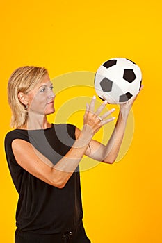 Woman playing with a soccer ball