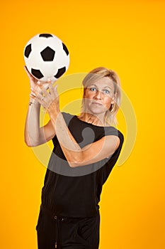 Woman playing with a soccer ball