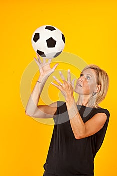 Woman playing with a soccer ball