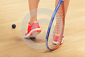 Woman playing squash