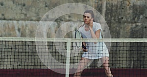 Woman playing tennis on a court