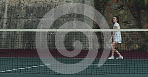 Woman playing tennis on a court