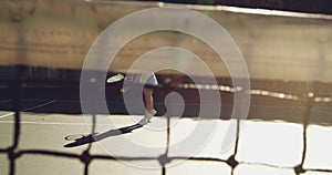 Woman playing tennis on a sunny day