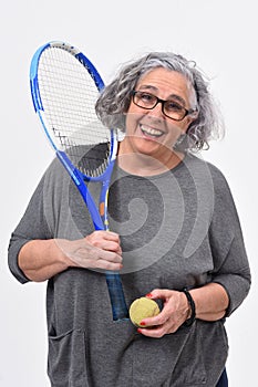 Woman playing tennis on white background