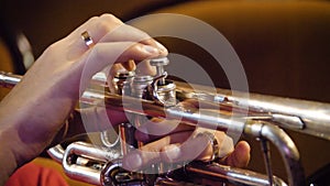 Woman playing trumpet. Trumpet player. Trumpeter playing music jazz instrument. Brass orchestra instrument. Woman plays