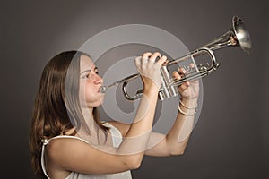 Woman playing a trumpet photo