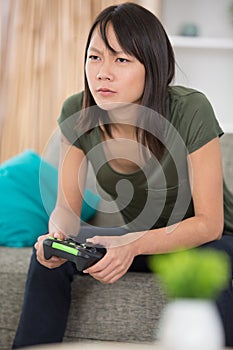 woman playing video game alone