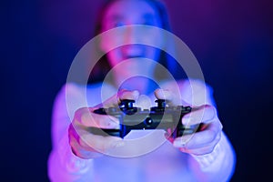 Woman Playing Video Games At Night, pushing on buttons, closeup