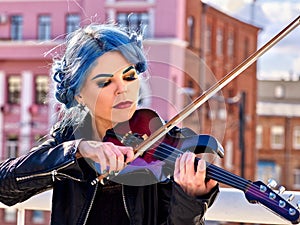 Woman playing violin alone