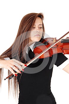A woman playing the violin in a close up image