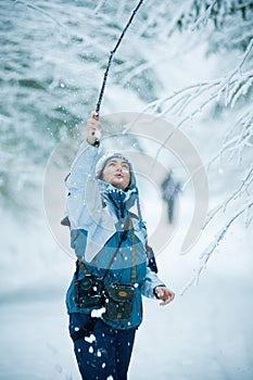 Woman playing in winter snow