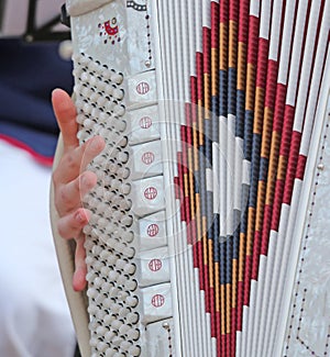 Woman plays the ancient accordion keyboard