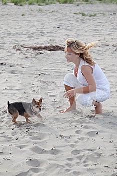 Woman plays with dog