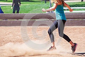 A Woman Plays a Game of Kickball