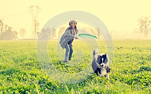 Woman plays with her dog photo