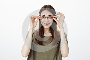 Woman pleased buy new glasses, finally see clearly. Good-looking cheerful girlfriend with beautiful emotive smile