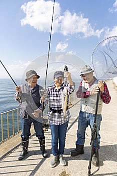 A woman pleased to catch a big fish