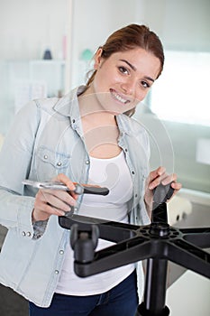 woman with pliers repairing castors on chair