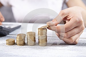 Woman plotted a graph with coins