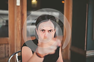 Woman pointing with angry expression