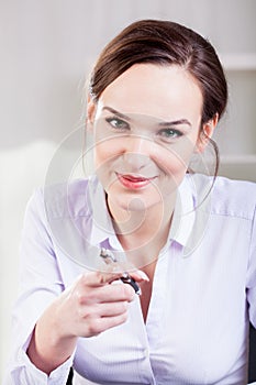 Woman pointing with a ballpen photo