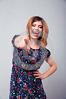 Woman pointing at camera