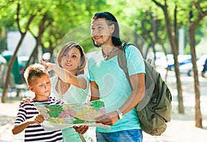 Woman pointing the direction for family