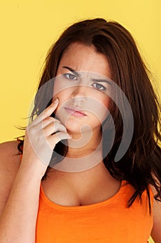 Woman pointing finger at her teeth