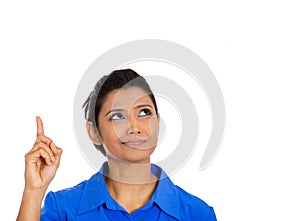 Woman pointing with index finger up and looking away or having the right answer