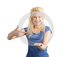 Woman pointing at invisible objet that she is holding photo
