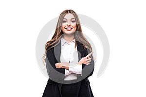 Woman pointing and looking to the side. Casual young businesswoman miling at copy space.