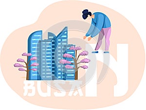 Woman pointing at national korean tree next to skyscraper. Poster advertising Busan in South Korea