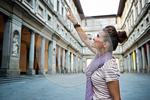 Woman pointing near uffizi gallery in florence