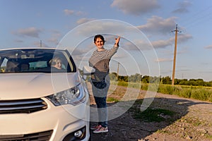 Woman pointing out the way to a female driver