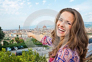 Woman pointing on panoramic view of florence