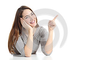 Woman pointing and presenting at side