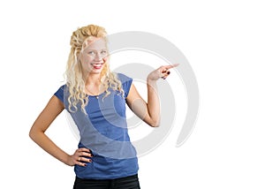 Woman pointing at something with her finger and smiling
